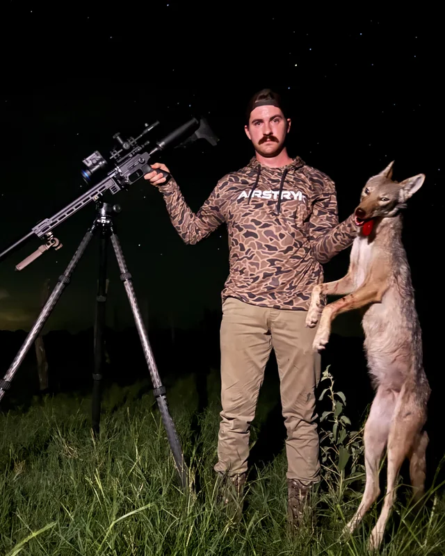 Night predator control with a scoped and moderated PCP air rifle on a tripod